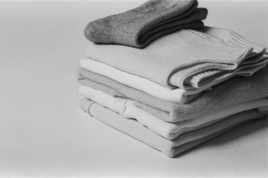 A stack of folded knitwear
